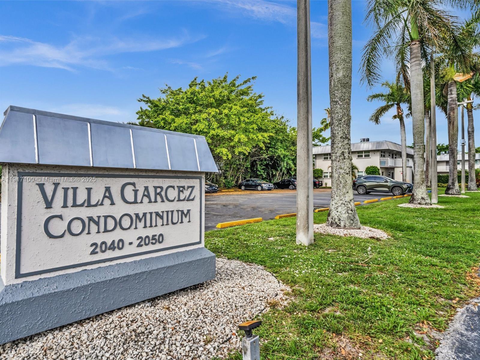 2050 Northwest 89th Avenue, Unit 211 Pembroke Pines, FL 33024 - Photo 3 of 14 a sign on the side of a building