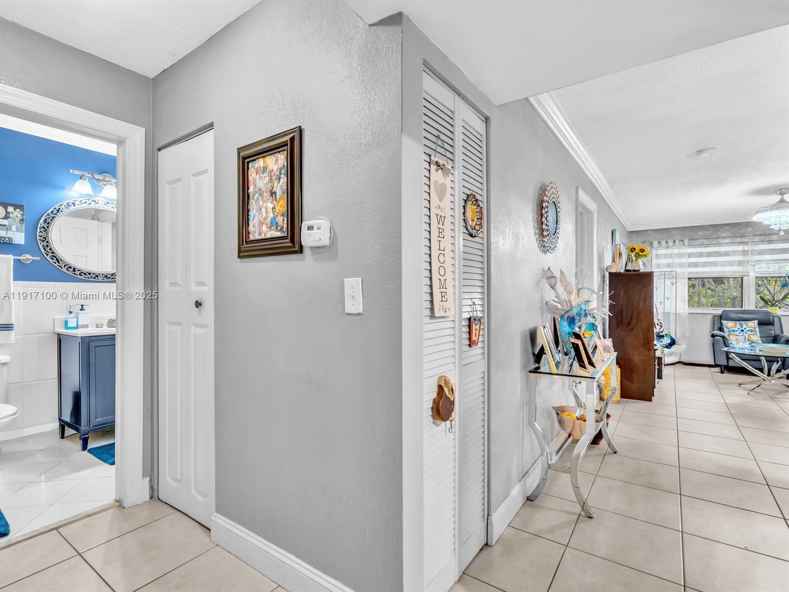 2050 Northwest 89th Avenue, Unit 211 Pembroke Pines, FL 33024 - Photo 6 of 14 a view of a livingroom with entry way