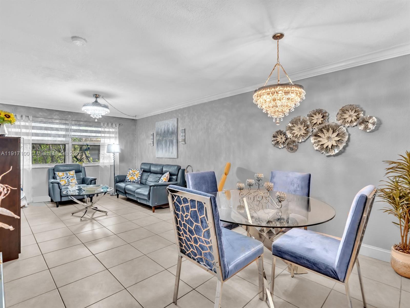 2050 Northwest 89th Avenue, Unit 211 Pembroke Pines, FL 33024 - Photo 7 of 14 a view of a dining room and livingroom