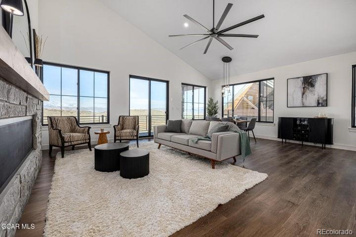 634 Lower Ranch View Road Granby, CO 80446 - Photo 11 of 50 a living room with furniture fireplace and a large window