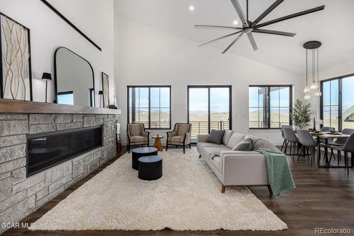 634 Lower Ranch View Road Granby, CO 80446 - Photo 12 of 50 a living room with furniture and a fireplace