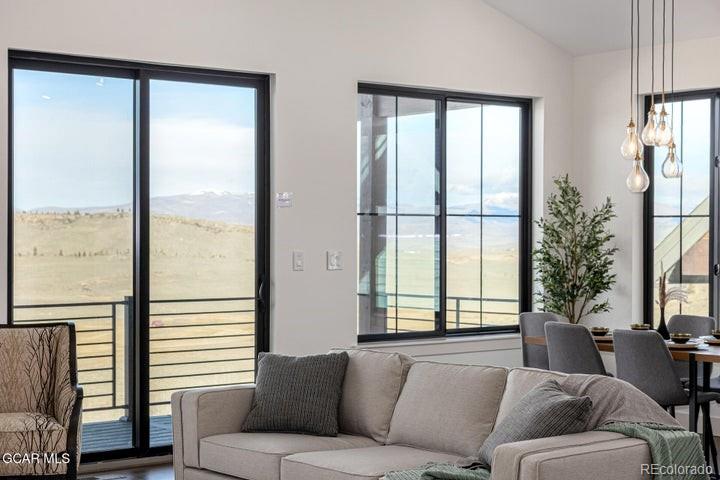 634 Lower Ranch View Road Granby, CO 80446 - Photo 13 of 50 a living room with furniture and a window