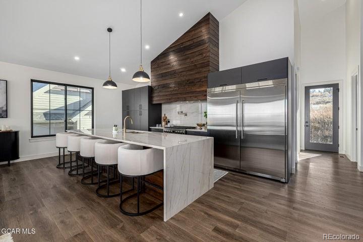 634 Lower Ranch View Road Granby, CO 80446 - Photo 16 of 50 a kitchen with a refrigerator and a sink