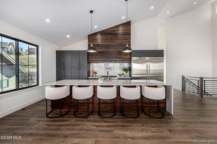 634 Lower Ranch View Road Granby, CO 80446 - Photo 17 of 50 a view of a dining room with furniture window and wooden floor
