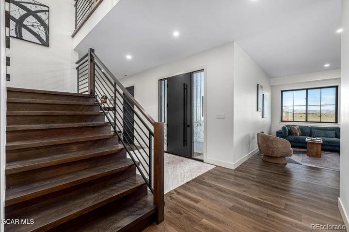 634 Lower Ranch View Road Granby, CO 80446 - Photo 20 of 50 a living room with furniture and wooden floor