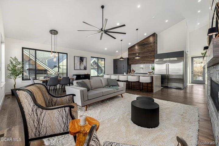 634 Lower Ranch View Road Granby, CO 80446 - Photo 2 of 50 a living room with furniture kitchen view and a chandelier