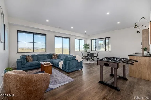 a view of a dining room with furniture window and wooden floor