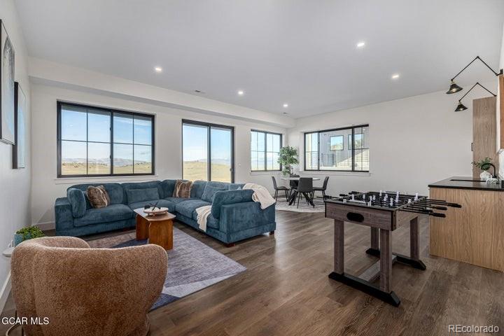 634 Lower Ranch View Road Granby, CO 80446 - Photo 24 of 50 a living room with furniture rug and window