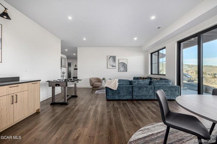 634 Lower Ranch View Road Granby, CO 80446 - Photo 26 of 50 a living room with furniture and a wooden floor