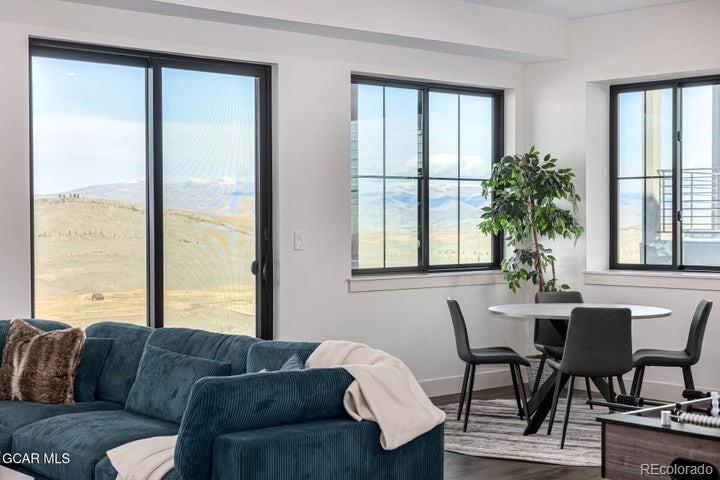 634 Lower Ranch View Road Granby, CO 80446 - Photo 27 of 50 a living room with furniture and a large window