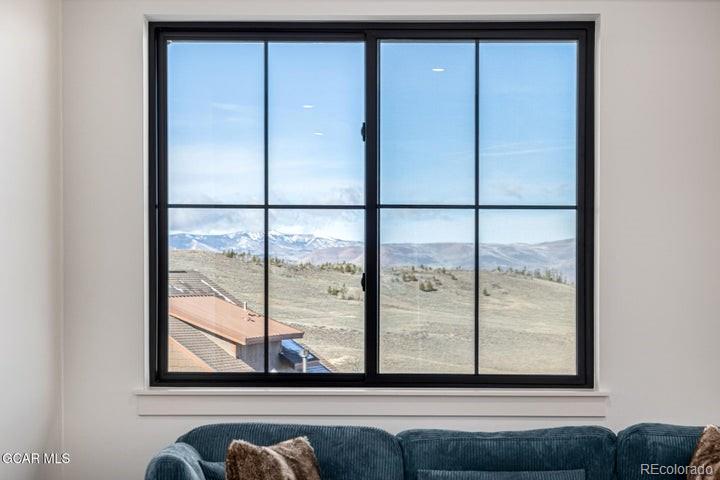 634 Lower Ranch View Road Granby, CO 80446 - Photo 28 of 50 a view of a room that has a large window and a bed