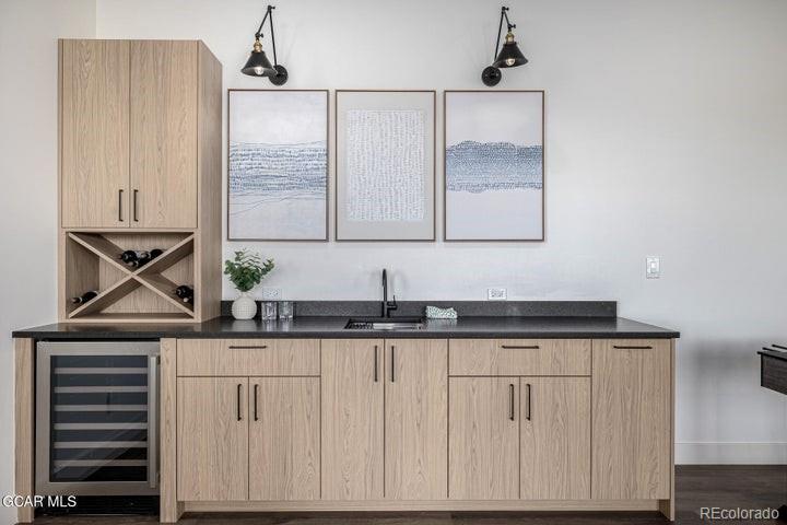 634 Lower Ranch View Road Granby, CO 80446 - Photo 29 of 50 a bathroom with a granite countertop sink a vanity and mirror