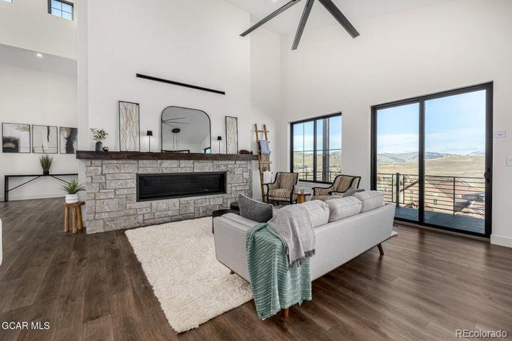 634 Lower Ranch View Road Granby, CO 80446 - Photo 34 of 50 a living room with furniture and a fireplace