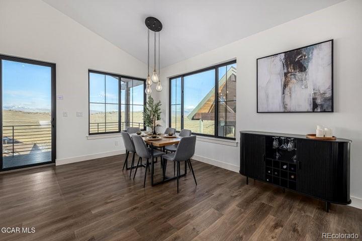 634 Lower Ranch View Road Granby, CO 80446 - Photo 37 of 50 a view of a dining room with furniture window and wooden floor
