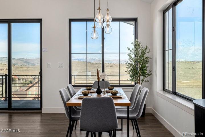 634 Lower Ranch View Road Granby, CO 80446 - Photo 38 of 50 a view of a dining room with furniture window and wooden floor