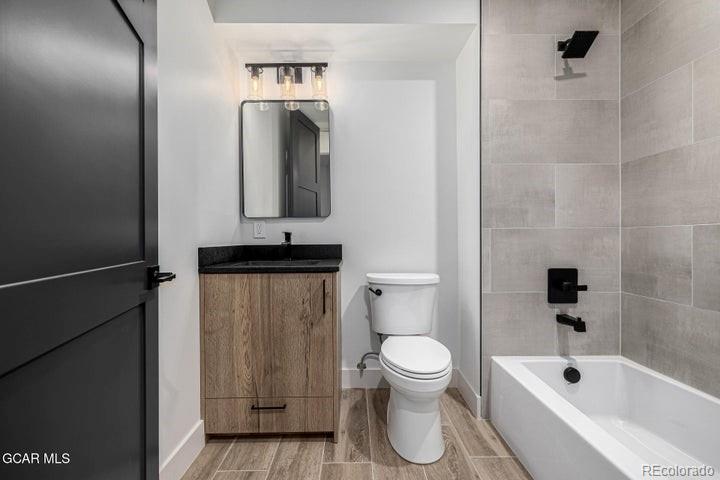 634 Lower Ranch View Road Granby, CO 80446 - Photo 48 of 50 a bathroom with a toilet a sink and bathtub