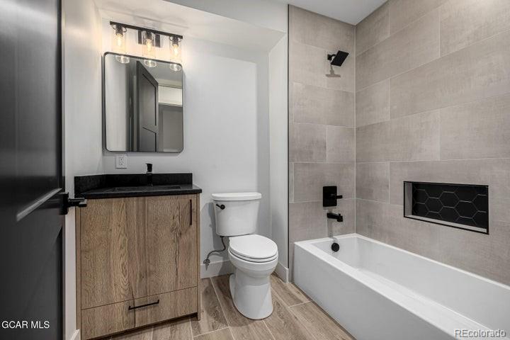 634 Lower Ranch View Road Granby, CO 80446 - Photo 49 of 50 a bathroom with a toilet a sink and bathtub