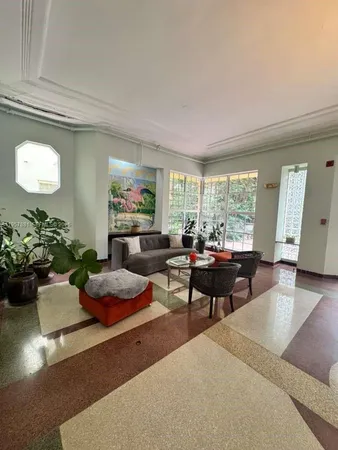 a living room with furniture and a window