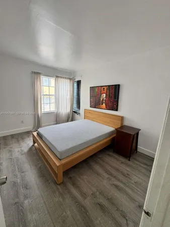 a room with pool table and couch
