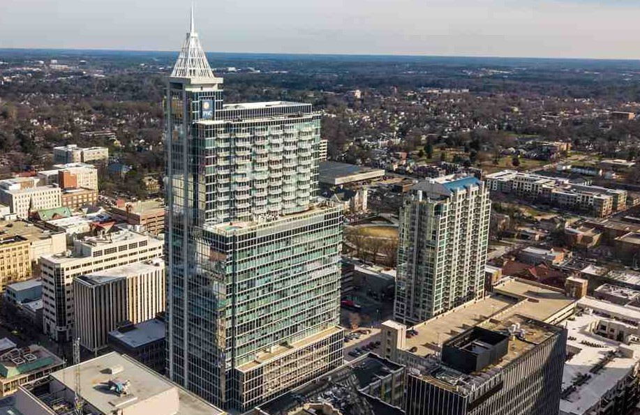 301 Fayetteville Street, Unit 2408 Raleigh, NC 27601 - Photo 1 of 19 Aerial shot of Raleigh's iconic PNC tower, in which the amazing Plaza Residences are located. Facade/Exterior Front