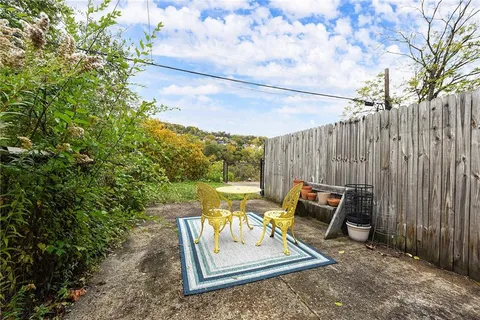 a view of a outdoor sitting area with furniture