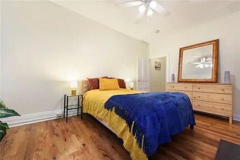 a bedroom with a bed and a dresser