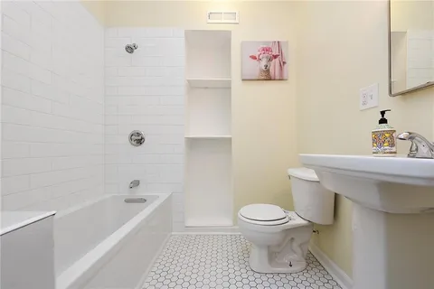 a bathroom with a toilet and a sink