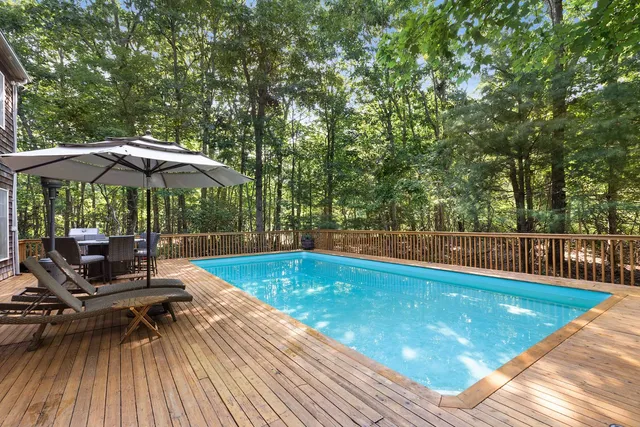 a view of a swimming pool with a patio