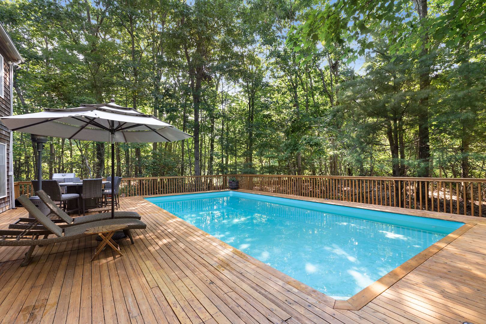 a view of a swimming pool with a patio