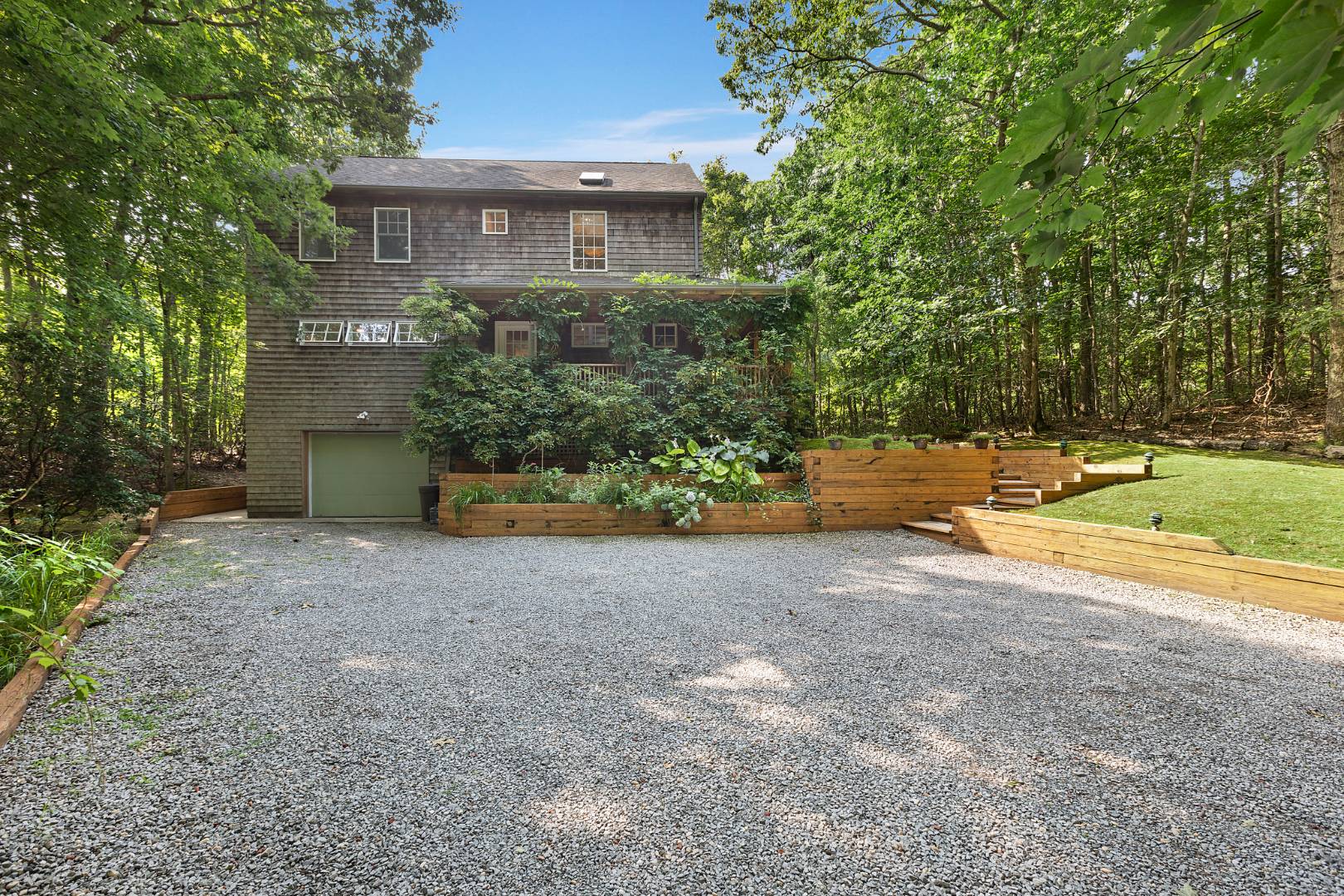 25 Old Sag Harbor Road Bridgehampton, NY 11963 - Photo 3 of 19 a view of a house with a yard and a large tree