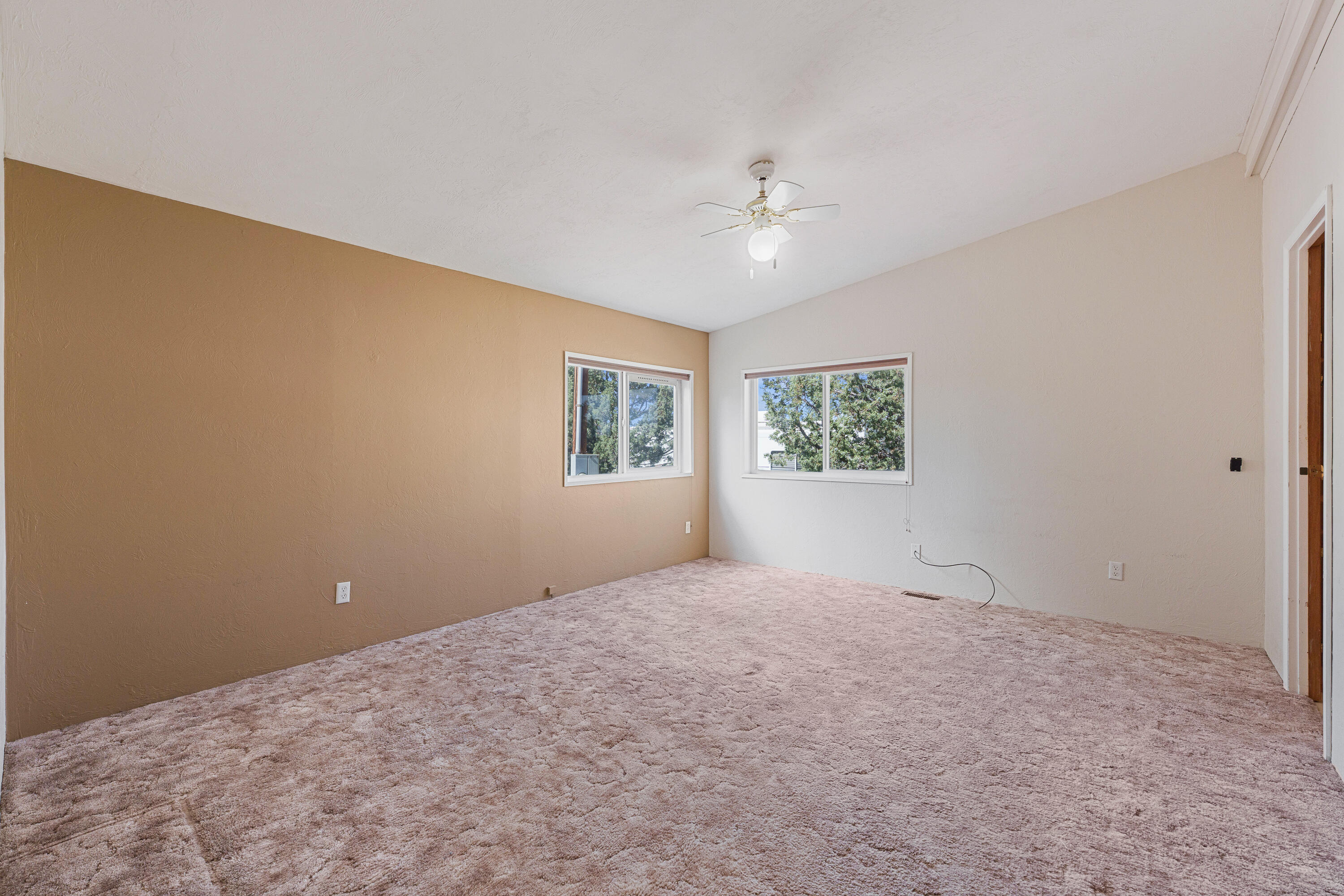 5674 Southeast Davis Loop Prineville, OR 97754 - Photo 18 of 48 an empty room with windows and fan
