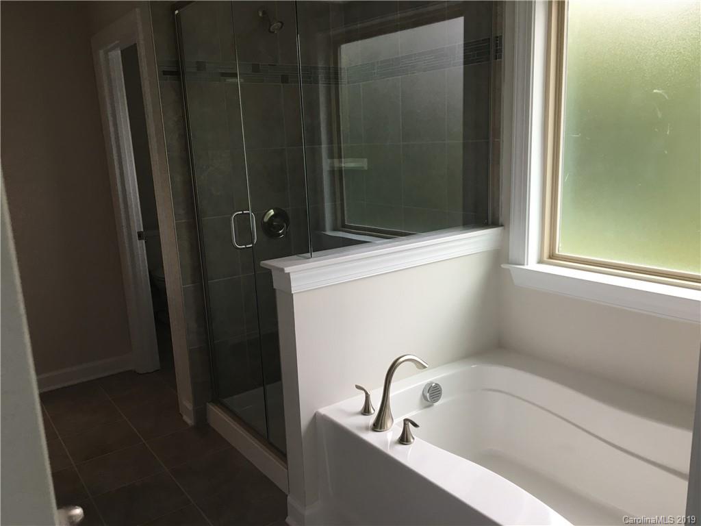 17535 Shearer Road Davidson, NC 28036 - Photo 13 of 22 a bathroom with a bathtub