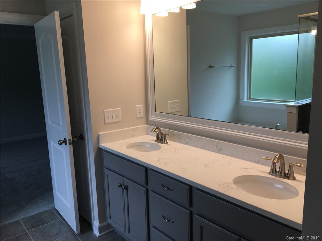 17535 Shearer Road Davidson, NC 28036 - Photo 14 of 22 a bathroom with a granite countertop sink and a mirror