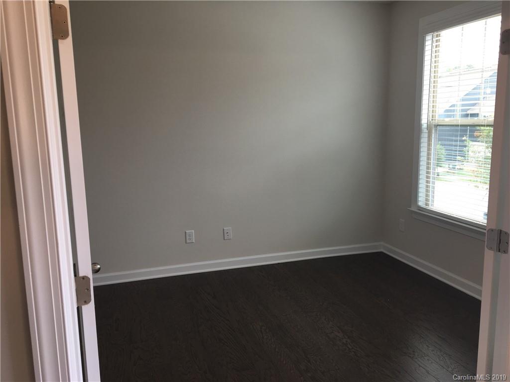 17535 Shearer Road Davidson, NC 28036 - Photo 3 of 22 an empty room with wooden floor and windows