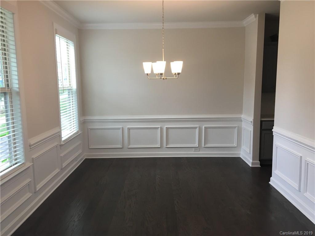 17535 Shearer Road Davidson, NC 28036 - Photo 4 of 22 an empty room with wooden floor and windows