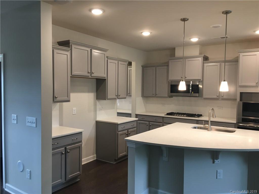 17535 Shearer Road Davidson, NC 28036 - Photo 7 of 22 a kitchen with a sink cabinets and window