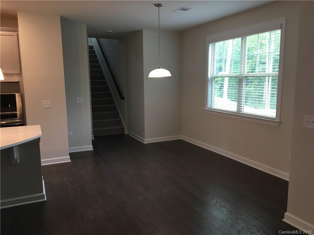 17535 Shearer Road Davidson, NC 28036 - Photo 8 of 22 an empty room with wooden floor and windows