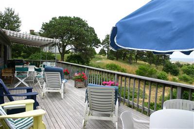 Undisclosed Address Orleans, MA 02653 - Photo 3 of 9 a balcony with table and chairs