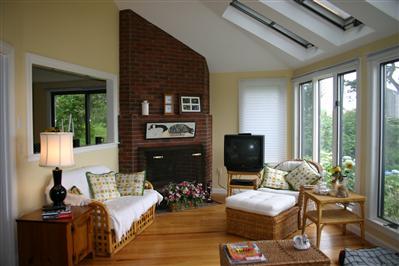 Undisclosed Address Orleans, MA 02653 - Photo 4 of 9 a living room with furniture fireplace and flat screen tv