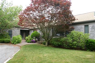 Undisclosed Address Orleans, MA 02653 - Photo 7 of 9 front view of a house with a yard