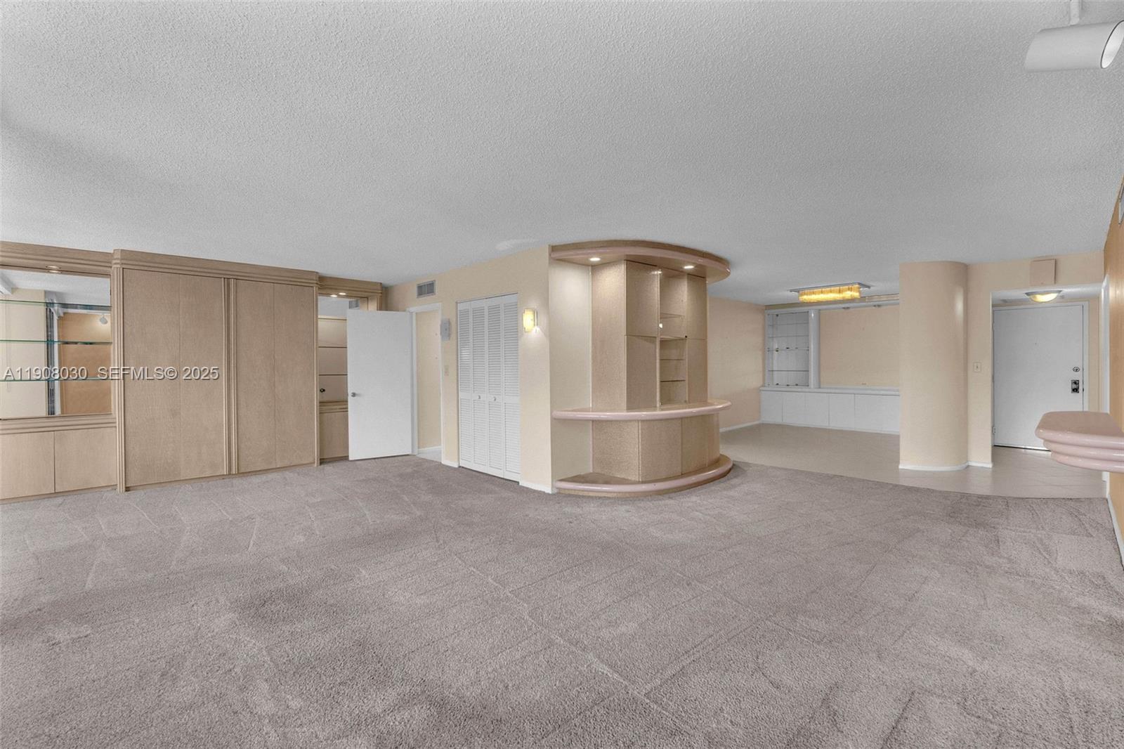 2810 North 46th Avenue, Unit F655 Hollywood, FL 33021 - Photo 17 of 52 a view of empty room with a fireplace