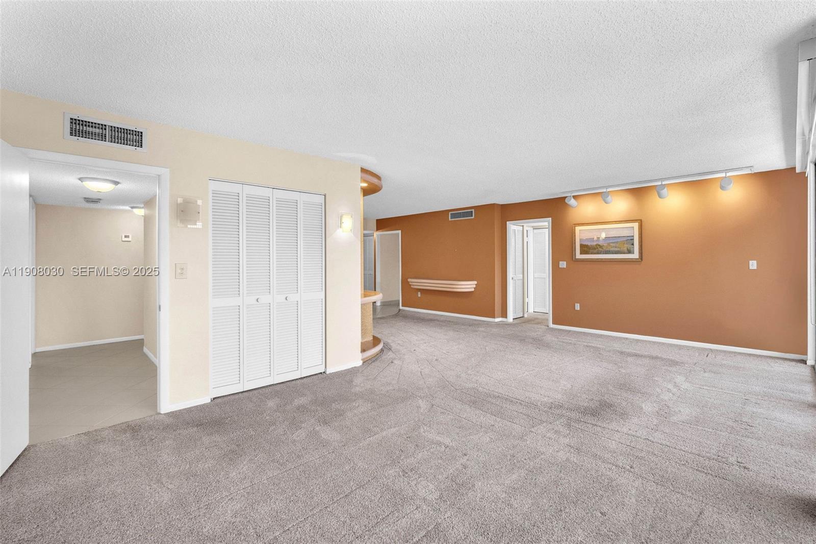 2810 North 46th Avenue, Unit F655 Hollywood, FL 33021 - Photo 18 of 52 a view of an empty room with a window