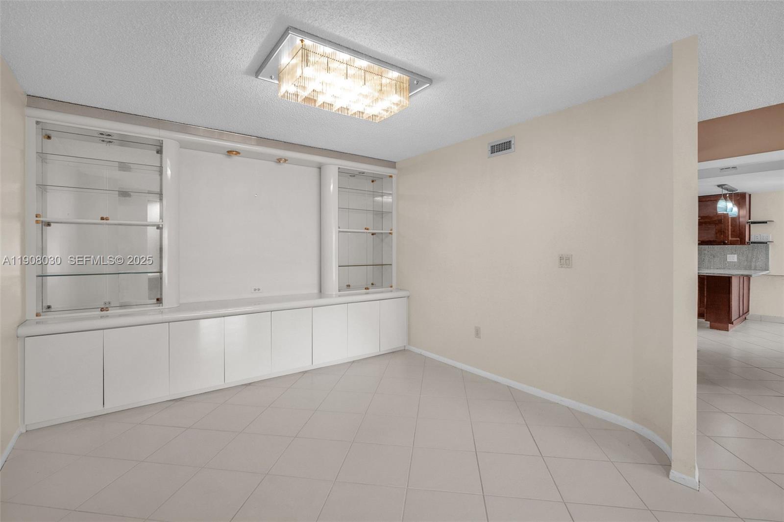 2810 North 46th Avenue, Unit F655 Hollywood, FL 33021 - Photo 20 of 52 an empty room with shelves