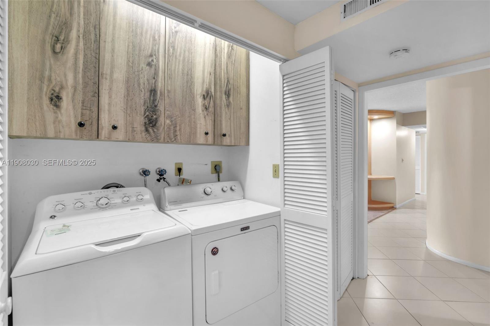 2810 North 46th Avenue, Unit F655 Hollywood, FL 33021 - Photo 30 of 52 a utility room with dryer and washer