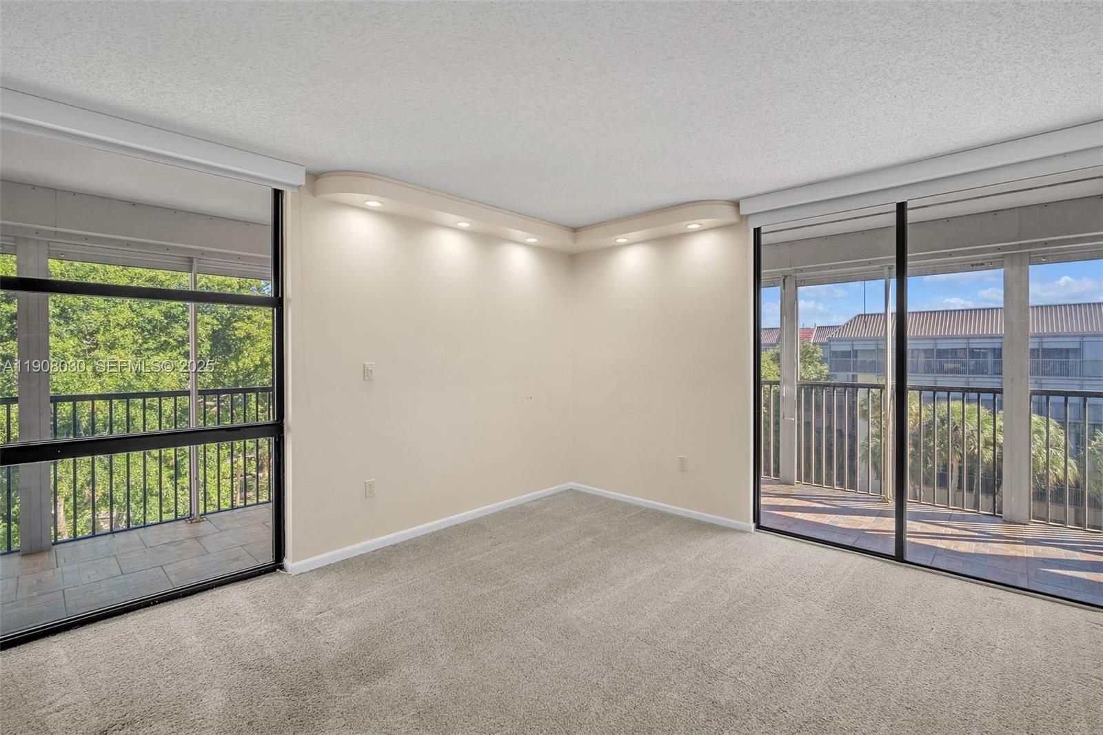 2810 North 46th Avenue, Unit F655 Hollywood, FL 33021 - Photo 31 of 52 a view of an empty room with a sliding door