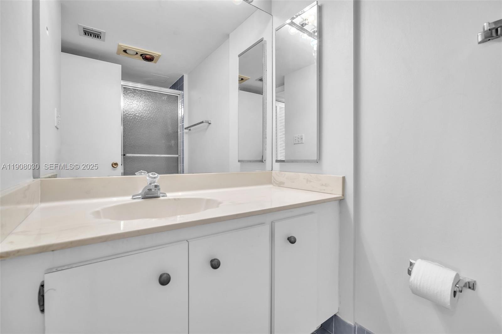 2810 North 46th Avenue, Unit F655 Hollywood, FL 33021 - Photo 33 of 52 a bathroom with a sink and a mirror