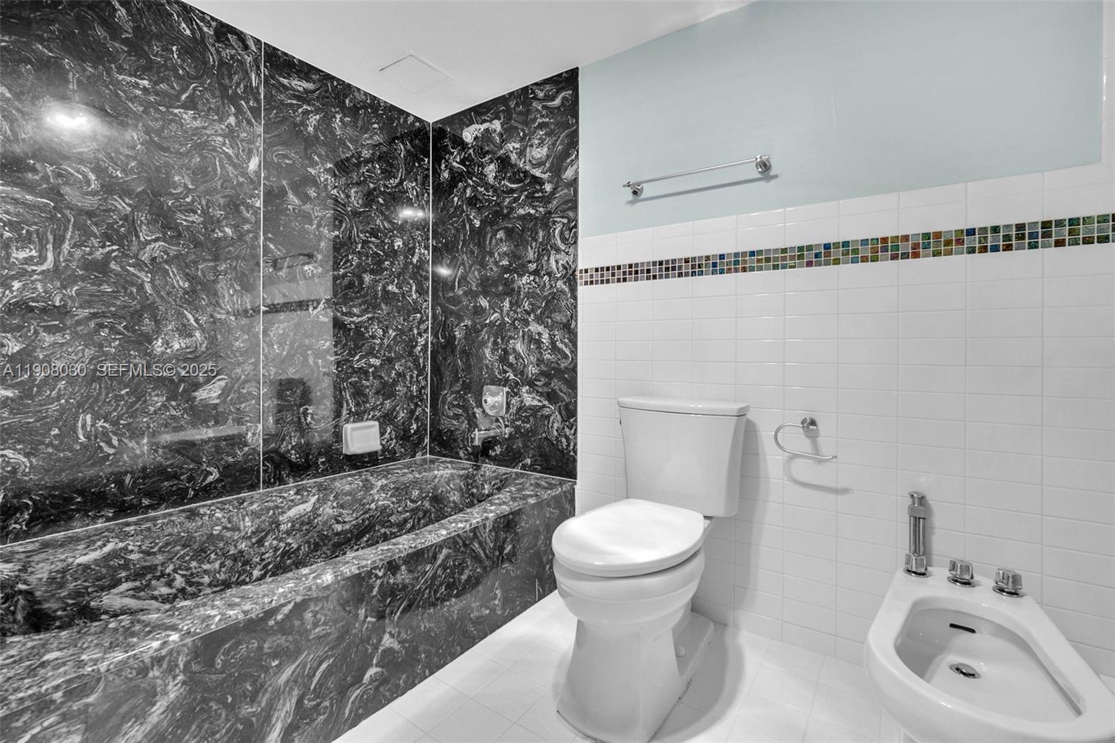 2810 North 46th Avenue, Unit F655 Hollywood, FL 33021 - Photo 41 of 52 a bathroom with a toilet sink and shower
