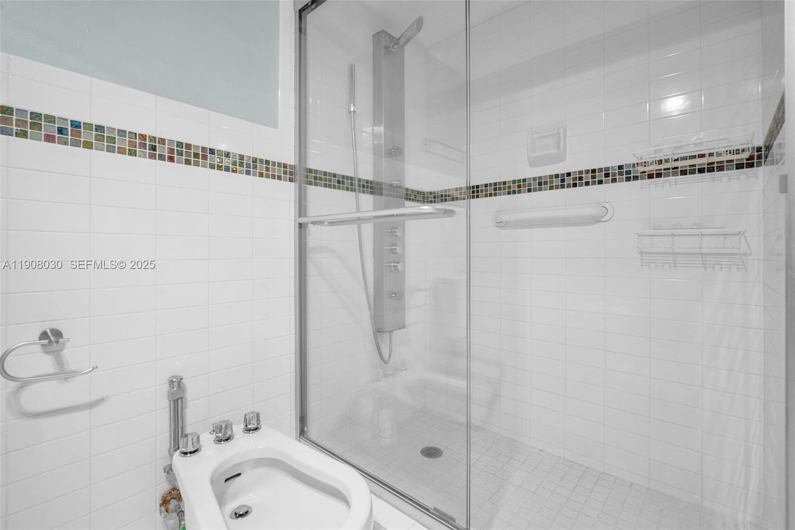 2810 North 46th Avenue, Unit F655 Hollywood, FL 33021 - Photo 43 of 52 a bathroom with a shower and a sink