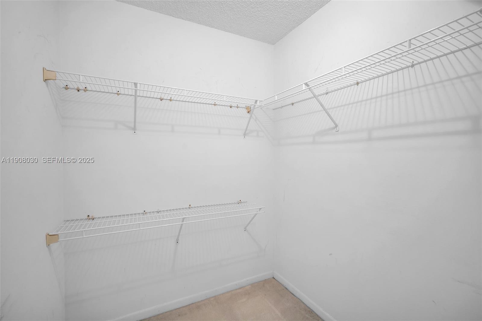 2810 North 46th Avenue, Unit F655 Hollywood, FL 33021 - Photo 45 of 52 a view of a room with racks on the wall