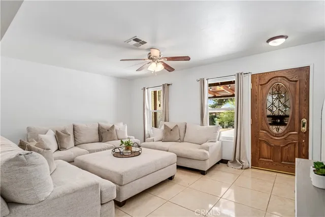 a living room with furniture and a window